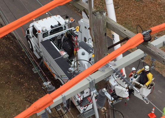 power repair truck seen through power lines