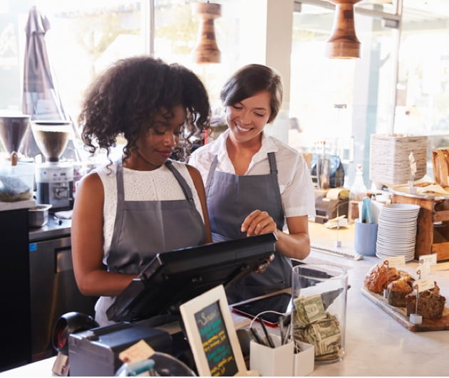 2 staffs working at the register