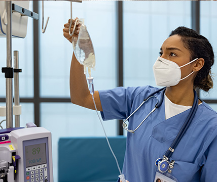 doctor checking the IV bag