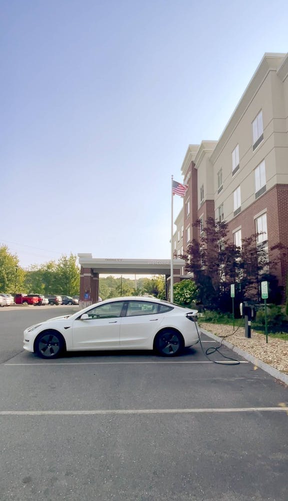 Photo of  EV charging in a parking lot