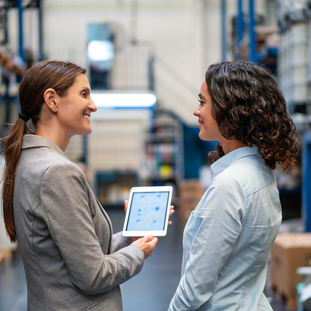 Employees looking at handheld device