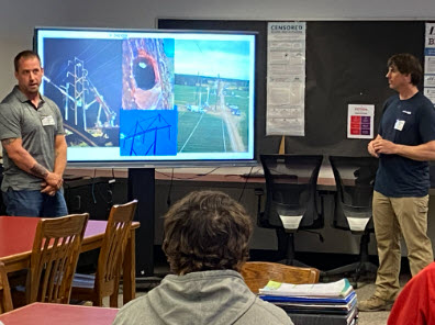 Adam and Troy presenting to students