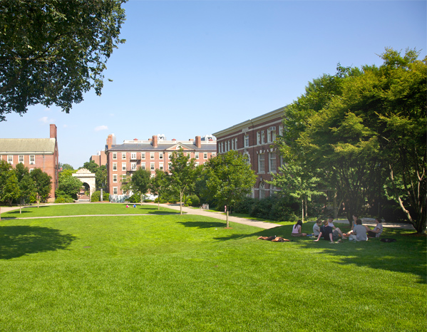 College building with students on lawn