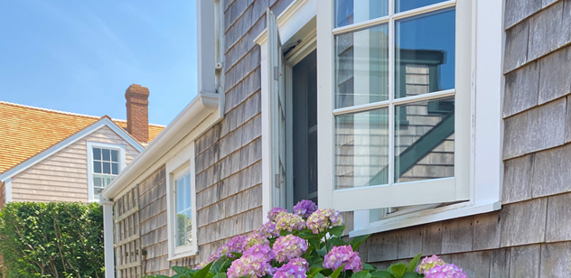 Open house window and flowers