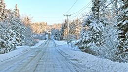 power lines above snowy roads